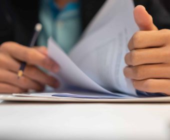 Start up learning for Document report business note in meeting room concept: Businessman manager hands writing for reading, signing in paperwork or documentation files at corporate on office desk