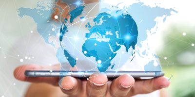 Businessman,Holding,Global,Network,And,Data,Exchanges,Over,His,Phone