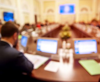 Conference room or seminar meeting room in business event. Session of Government. Academic classroom training course in lecture hall. blur abstract background. working in modern bright office indoor