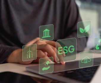 A person interacts with a digital interface showing icons related to ESG (Environmental, Social, Governance) principles.