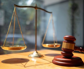 A judge gavel is prepared in the courtroom to be used to give a signal when the verdict is read after the trial is completed. Concept judge gavel is prepared to symbolize the decision in a court case.