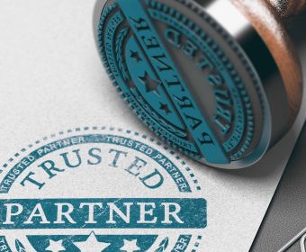 Trusted partner mark imprinted on a paper background with rubber stamp. Concept of trust in business and partnership. 3D illustration